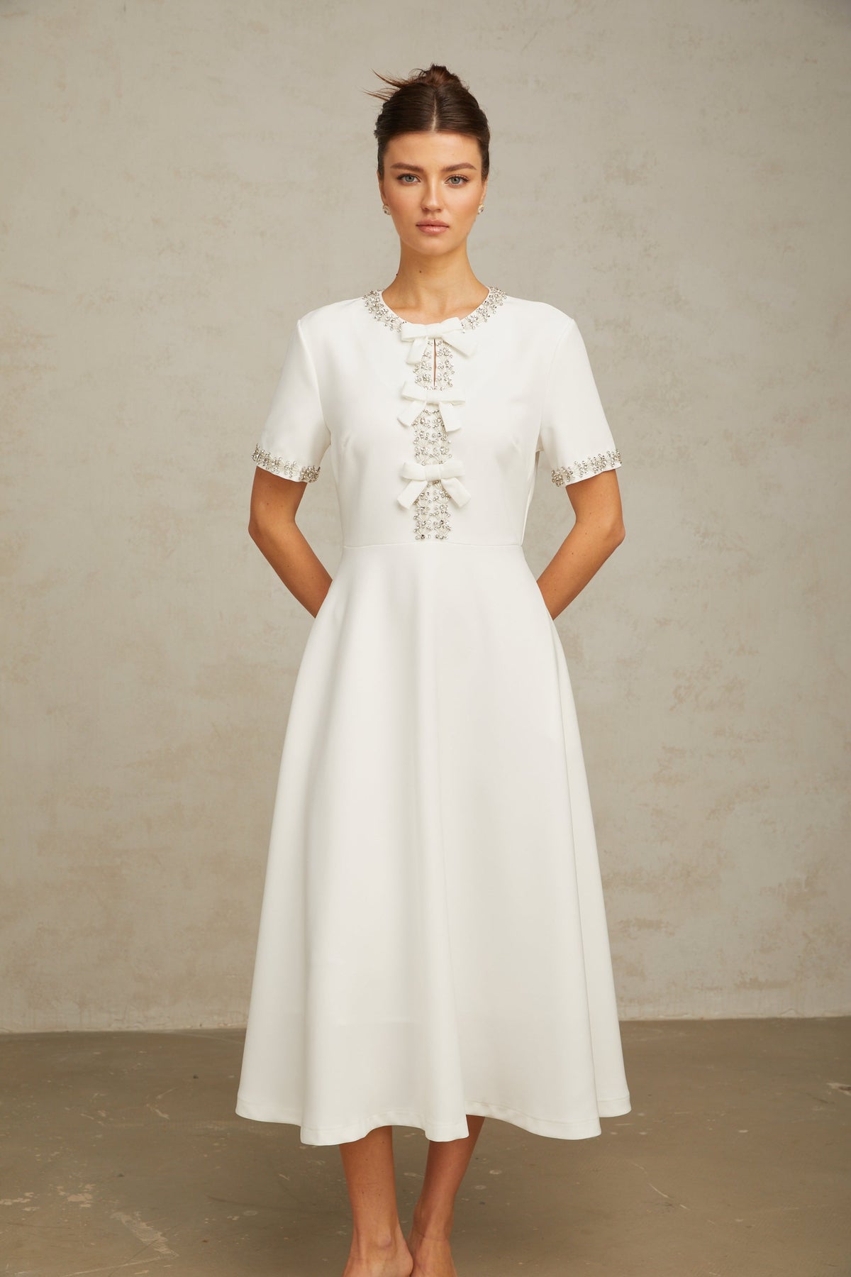 Cassiopeia crystal-accented bow midi dress in White