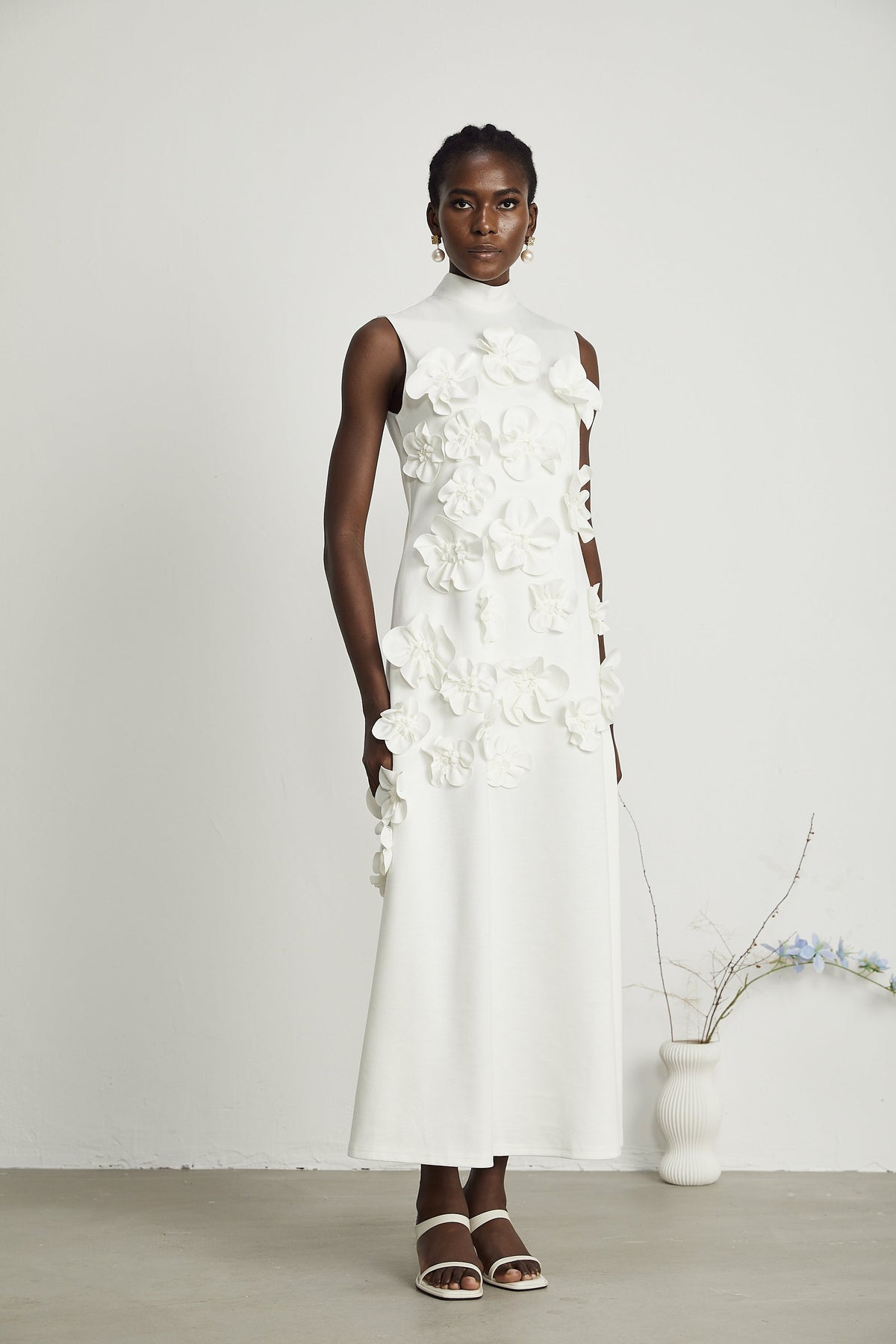 Magali White Sleeveless Maxi Dress with Faux Flower & Bow-Tie Embellishment