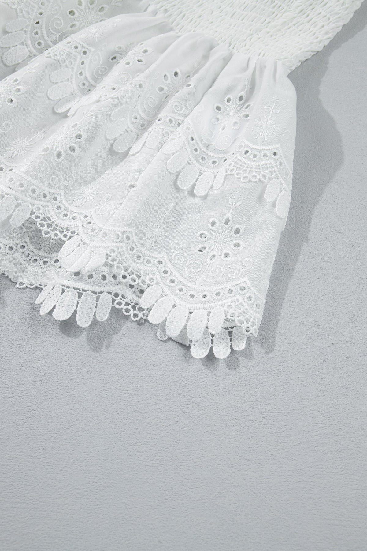 White Sleeveless Smocked Lace Peplum Top